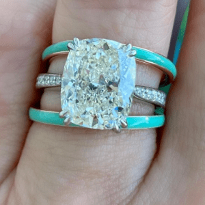diamond ring with two turquoise rings on hand