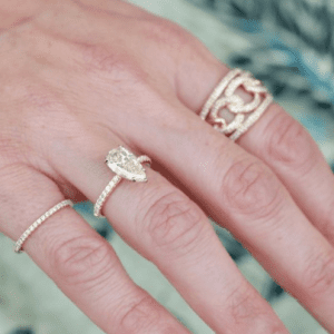 gold and diamond rings on hand