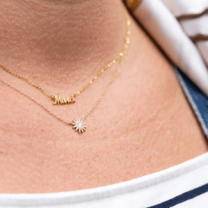 two gold necklaces on model