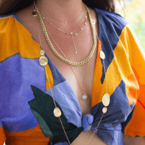 gold necklaces on model