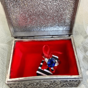 sapphire and diamond ring in silver and red box