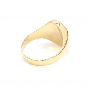 135 degree angle of ring. A polished yellow gold shank thickens towards the top, center where it meets the polished back of an oval signet face.