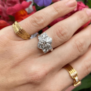 diamond ring and gold rings on hand