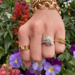 diamond ring and gold rings on hand