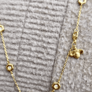 gold diamond necklace with honeybee