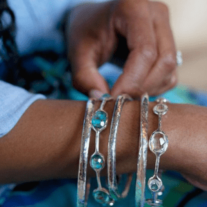 turquoise and silver bracelets on model