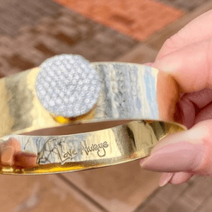 gold and diamond bracelet with "love always" engraved on inside