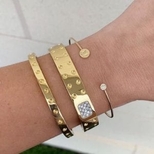 gold bracelets on wrist
