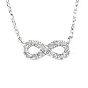 Sterling silver and diamond necklace in infinity loop shape on white background.