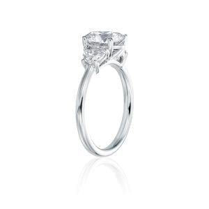 oval with halfmoon three stone engagement ring angle view