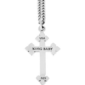 back of silver cross pendant with pointed ends with "king Baby" engraved