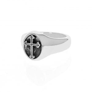side angle view of silver mens signet ring with black cross in center