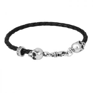 king_baby_bracelet_thin_black_braided_leather_bracelet_with_sterling_silver_scull_heads_framing_lobster_clasp