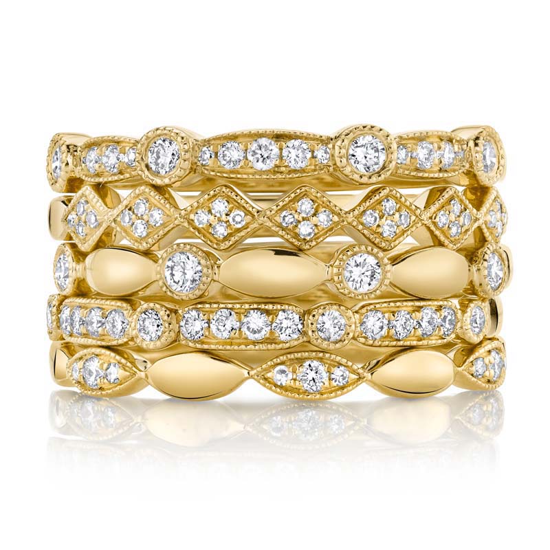 stack of diamond rings in 14kt yellow gold