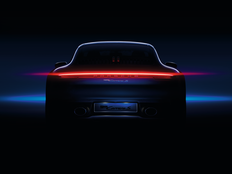 Back of Porsche car on dark background