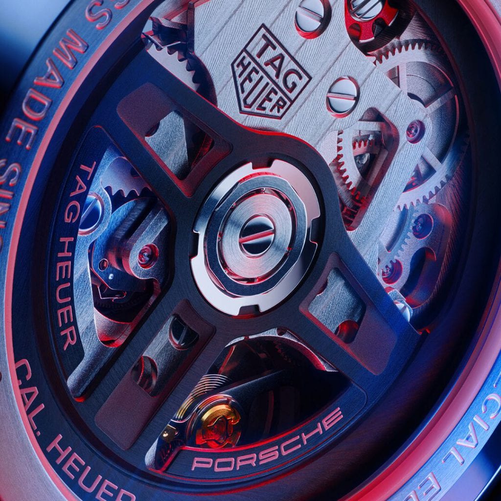 Back of the a watch. Mechanics of the TAG Heuer Carrera Porsche Chronograph Watch are visible through a clear case.