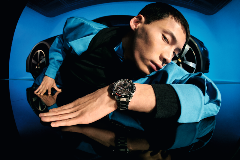 Man models Tag Heuer Carrera Porsche Chronograph Watch.