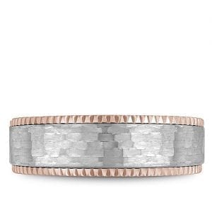 A Bleu Royale rose gold wedding band with a textured white gold center and milgrain detailing.