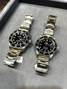 Two pre-owned Rolex Submariner Watches with Black Dial and Black Bezel