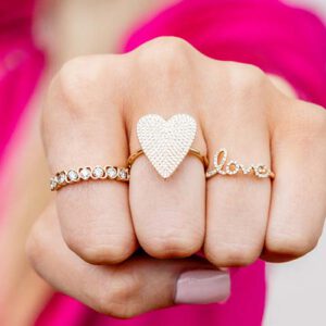 Gold and Diamond Rings in heart shape and spelling Love